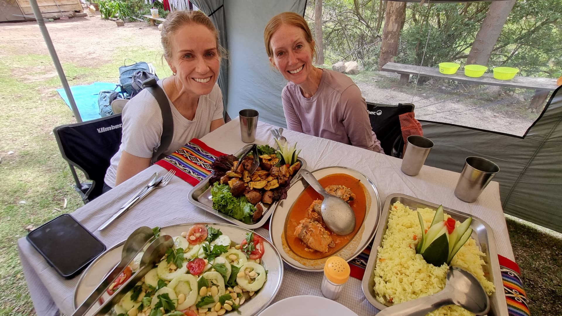 Morning Breakfast for Two Women in a Tent Morning Breakfast for Two Women in a Tent