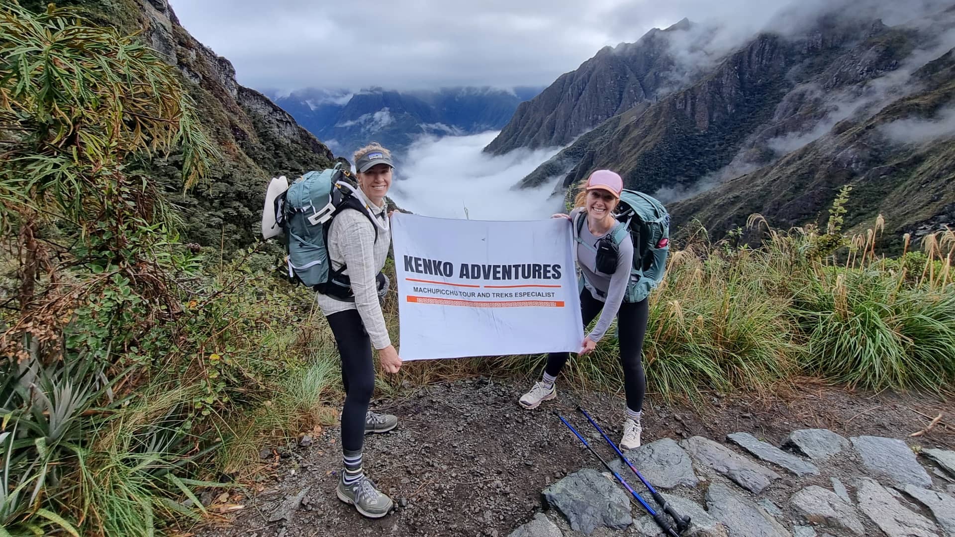 Tourists standing together with a cloudy sky in the background, surrounded by scenic mountain views in the Andes. Tourists standing together with a cloudy sky in the background, surrounded by scenic mountain views in the Andes.