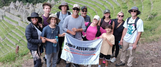 A group of tourist by wiñayhuayna inca site on the inca trail 