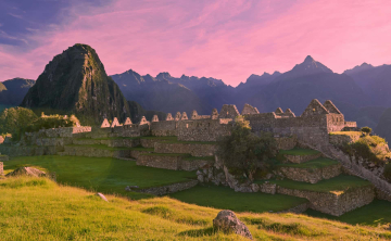 Sun setting over Machu Picchu's esplanade.