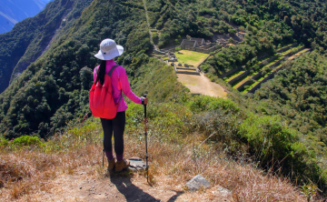 A trekker on a mountain trail in the Andes, showcasing the rugged terrain typical of the Choquequirao Trek.